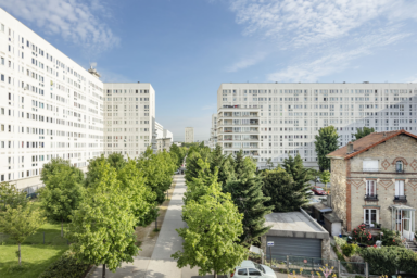 photo d'un quartier de la ville de Villeneuve-la-Garenne avec des immeubles et des arbres.
